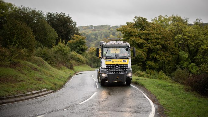 Highways maintenance Highways maintenance vehicle on a winding rural road