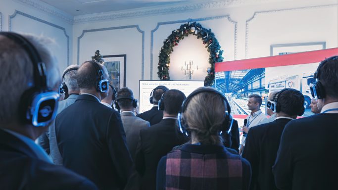 Event audience Guests watching a presentation at an indoor business event